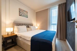 Giường trong phòng chung tại Invictus Hotel +88 ảnh