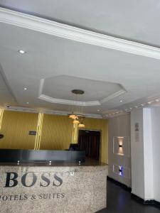 a lobby of a hotel with a reception desk at BOSS HOTELS & SUITES in Lagos