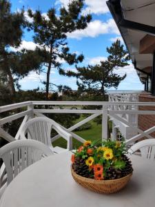 a basket of flowers sitting on a table at The Residence Costa del Este in Costa del Este
