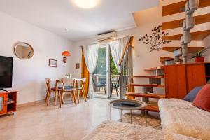 a living room with a couch and a table at Apartments Viva in Korčula
