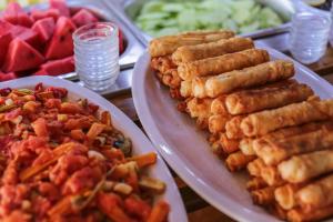 two plates of food on a table with food at Hotel Sonne - Adults Only in Kaş