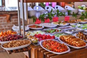a buffet filled with lots of different types of food at Hotel Sonne - Adults Only in Kaş