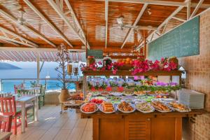 a buffet in a restaurant with food on display at Hotel Sonne - Adults Only in Kaş