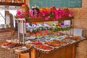 a buffet with many plates of food on a table at Hotel Sonne - Adults Only in Kaş
