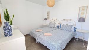 En eller flere senge i et værelse på Arrecife Apartamento Centrico con terraza