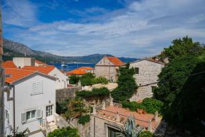 a view of a town with orange roofs at Apartments Viva in Korčula