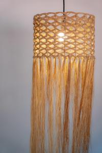 a bunch of hair hanging from a basket at Pousada Por do Sol Trancoso in Trancoso +107 photos
