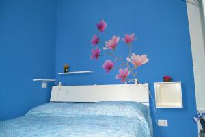 เตียงในห้องที่ Piccola Suite Blu
