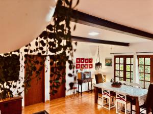 a living room with a table and a dining room at Click&Guest - Los Almendros in Las Casillas