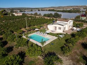 an aerial view of a house with a swimming pool at PROFUMO DI ZAGARA 6&2 Emma Villas in Ispica