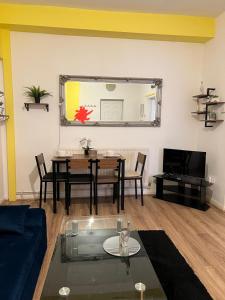 a living room with a table and a couch at Good Heart in Birmingham
