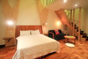 Postel nebo postele na pokoji v ubytování Yun Tien Feng Chuan B&B