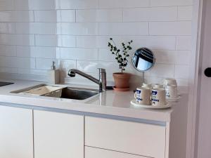 Η κουζίνα ή μικρή κουζίνα στο Staydrock +56 φωτογραφίες