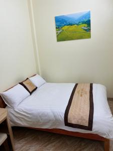 Postel nebo postele na pokoji v ubytování minh hieu hotel