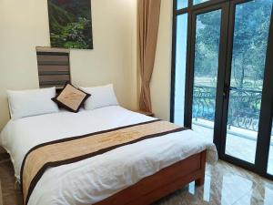 Postel nebo postele na pokoji v ubytování minh hieu hotel