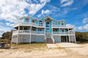 a large blue and white house on the beach at SEMI-OCEANFRONT, Wild Horses, Private Pool-4x2238, Finally Here in Knotts Island
