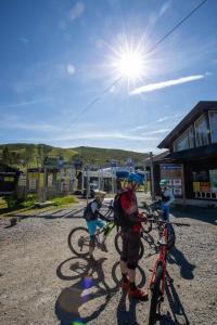 a group of people standing with their bikes at Stay in the heart of Geilo, walk to everything in Geilo