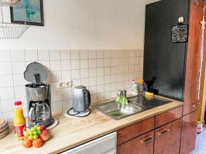 a kitchen with a sink and a counter top with fruit at Holiday Home Bella by Interhome in Hohen Wieschendorf