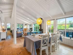 a dining room with a table and chairs at Holiday Home Danko - 1-5km from the sea by Interhome in Fanø