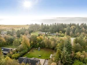 an aerial view of a park with trees and water at Holiday Home Eisa - 300m to the fjord by Interhome in Øsløs