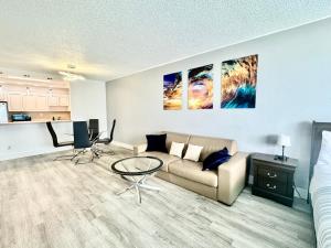 a living room with a couch and a table at Ocean Reserve Luxury Condo Sunny Isles Beach in Sunny Isles Beach
