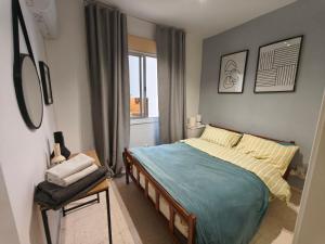 Una cama o camas en una habitación de Flamingo