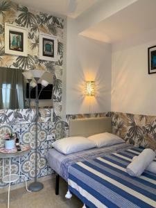 a hotel room with a bed and a table at Málaga Centro Hostel in Málaga