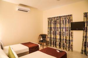 Кровать или кровати в номере Nanu Beach Resort & Spa