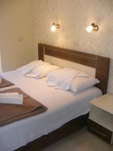 Cama o camas de una habitación en Hotel Obala