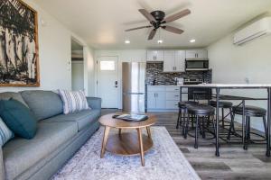 a living room with a couch and a table at Sunset Beach Resort in Osage Beach