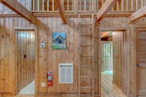 a wooden barn with a door and a fire extinguisher at Hidden Creek Cabin in Fleetwood +115 photos