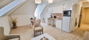 Kuchyň nebo kuchyňský kout v ubytování Résidence de Châtelleraut