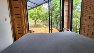 En eller flere senge i et værelse på Villa Oz021 Cottages + 59 billeder