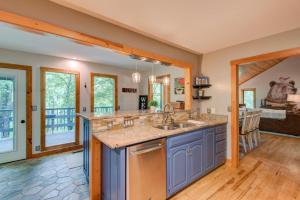 a kitchen with a sink and a counter at Paws A While in Blowing Rock +82 photos