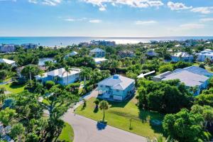 an aerial view of a home with the ocean in the background at Casa Al Mare in Sanibel Island