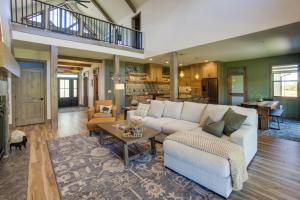 a living room with a couch and a table at 3 Mi to Dtwn Red Lodge Mtn-View Home with Hot Tub in Red Lodge