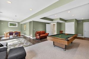 a living room with a pool table in it at Secluded Woodland Retreat Near Starved Rock Park home in Grand Ridge