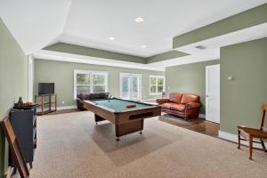 a living room with a pool table in it at Secluded Woodland Retreat Near Starved Rock Park home in Grand Ridge