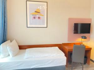 Μια τηλεόραση ή/και κέντρο ψυχαγωγίας στο Garner Hotel Hamburg - St Georg by IHG