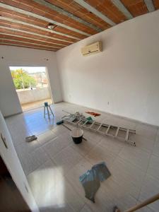 an empty room with a bed in the middle of it at Casa Praia do Gaviao in Araruama