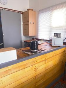 a kitchen with a counter top with a microwave at Jo-Anne Villa #Jeffreys Bay in Jeffreys Bay