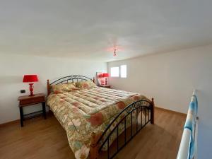 a bedroom with a bed and a table with a lamp at Luxury apartment Fes centre ville - Family & Friendly in Oulad Akkou