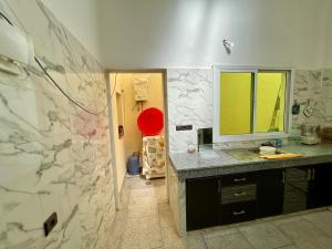 a bathroom with a counter and a sink and a mirror at Luxury apartment Fes centre ville - Family & Friendly in Oulad Akkou +22 photos