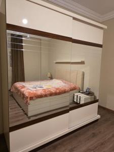 a bedroom with a bed in a glass wall at South B Paradise in Cairo