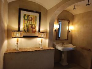 a bathroom with a sink and a mirror at Casa de Solís in Trujillo +61 photos