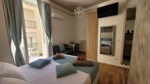 a bedroom with a bed and a large window at Il TulipanoNero in Chiavari