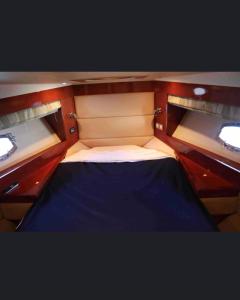 a small bed in the back of a boat at Croazieră exclusivistă in Eforie Nord