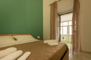 Ένα ή περισσότερα κρεβάτια σε δωμάτιο στο A casa di amici