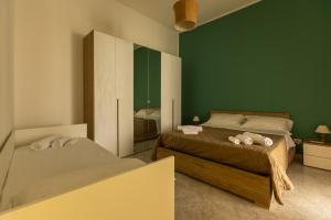 Ένα ή περισσότερα κρεβάτια σε δωμάτιο στο A casa di amici +15 φωτογραφίες