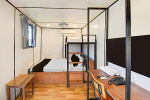 TV i/ili multimedijalni sistem u objektu Hotel O Citrus Resort